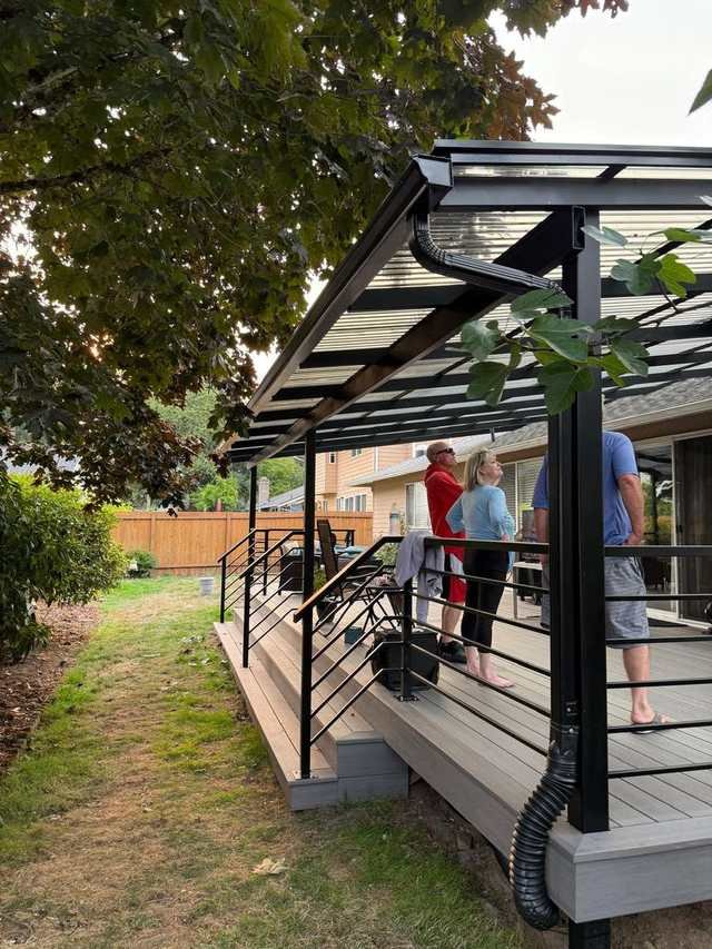 Covered composite deck with cable railing