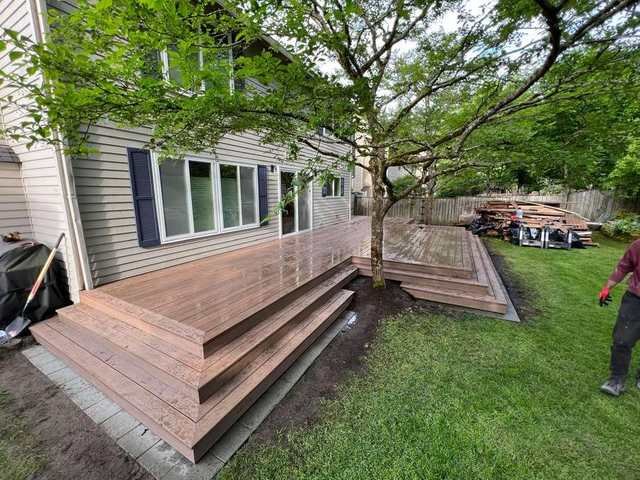 Composite deck rebuild framed around trees