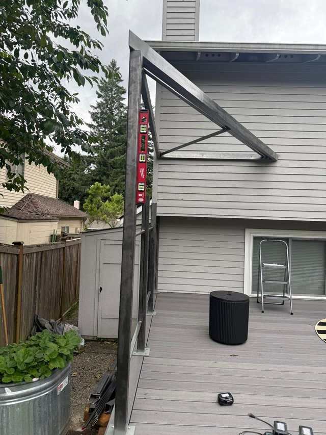 Steel patio cover frame over a composite deck